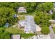 Home with a large backyard and detached shed, surrounded by trees at 1213 E Frierson Ave, Tampa, FL 33603