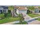 Single-story house in a community with similar homes and lush landscaping at 4838 Sevilla Shores Dr, Wimauma, FL 33598