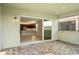 Covered patio with sliding glass doors leading to the kitchen and backyard at 4838 Sevilla Shores Dr, Wimauma, FL 33598