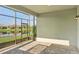 Spacious screened patio overlooking a peaceful lake view at 4838 Sevilla Shores Dr, Wimauma, FL 33598