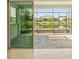 Enjoy water views from this screened patio with sliding glass doors at 4838 Sevilla Shores Dr, Wimauma, FL 33598