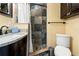 Clean bathroom with shower, granite countertop vanity, and toilet at 3625 W Tampa Cir, Tampa, FL 33629