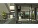 Modern interior with glass walls and a staircase at 1725 Gulf Rd, Tarpon Springs, FL 34689