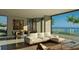 Bright dining room with large windows and ocean views at 1725 Gulf Rd, Tarpon Springs, FL 34689
