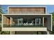 Modern two-story home with concrete exterior, large windows, and balcony at 1725 Gulf Rd, Tarpon Springs, FL 34689