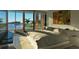 Main bedroom with large windows, ocean views, and a comfy bed at 1725 Gulf Rd, Tarpon Springs, FL 34689