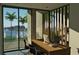 Home office with ocean views and built-in wooden wall at 1725 Gulf Rd, Tarpon Springs, FL 34689