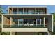 Modern two-story home with concrete exterior, large windows, and balcony at 1725 Gulf Rd, Tarpon Springs, FL 34689