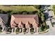 Aerial view of building and surrounding area, showing roofline and landscaping at 13506 Messina Loop # 105, Bradenton, FL 34211