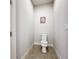 Small, private bathroom with a toilet and tile flooring at 13506 Messina Loop # 105, Bradenton, FL 34211