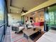 Relaxing screened patio with seating area, brick pavers, and views of the interior at 13506 Messina Loop # 105, Bradenton, FL 34211