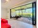Relaxing screened patio featuring outdoor seating and lush landscaping at 13506 Messina Loop # 105, Bradenton, FL 34211