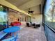Spacious screened patio with multiple seating areas and access to the interior at 13506 Messina Loop # 105, Bradenton, FL 34211