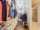 Spacious walk-in closet with custom shelving and a view of the bathroom at 13506 Messina Loop # 105, Bradenton, FL 34211