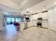 Modern kitchen with island and stainless steel appliances at 13506 Messina Loop # 105, Bradenton, FL 34211