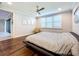 Main bedroom with hardwood floors, and access to a walk-in closet and bathroom at 13506 Messina Loop # 105, Bradenton, FL 34211