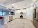 Modern kitchen with white cabinets and stainless steel appliances at 13506 Messina Loop # 105, Bradenton, FL 34211