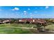 Aerial view of community clubhouse near golf course at 13506 Messina Loop # 105, Bradenton, FL 34211