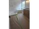 Elegant bathroom featuring a soaking tub, separate shower, and wood-toned vanity with dual sinks at 320 W Park Ave, Tampa, FL 33602