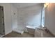 Modern bathroom with a standalone tub, tiled shower, and a sleek vanity at 320 W Park Ave, Tampa, FL 33602