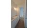 Bright bathroom with double sinks, white cabinetry, and modern fixtures at 320 W Park Ave, Tampa, FL 33602
