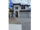 Elegant two-story home featuring a tile roof, arched entryway, and a spacious two-car garage at 320 W Park Ave, Tampa, FL 33602