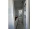 Hallway view featuring tile floor, a custom vanity, and a bathroom with a glass-enclosed shower at 320 W Park Ave, Tampa, FL 33602