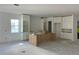 Spacious kitchen featuring custom cabinetry, a center island, and ample natural light from a large window at 320 W Park Ave, Tampa, FL 33602
