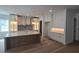 Open-concept kitchen featuring an island, stainless steel appliances, and ample cabinet space at 320 W Park Ave, Tampa, FL 33602