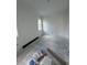 Bright room with white walls and floor tiles ready to install at 320 W Park Ave, Tampa, FL 33602