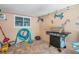Covered patio with grill, storage, and fun Gathering decor at 7127 Otter Creek Dr, New Port Richey, FL 34655