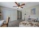 Bedroom with a bed, closet, and workspace at 7127 Otter Creek Dr, New Port Richey, FL 34655
