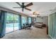 Main bedroom with pool view and private office space at 7127 Otter Creek Dr, New Port Richey, FL 34655