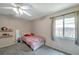 Cozy bedroom with carpeted floors and a window with natural light at 7127 Otter Creek Dr, New Port Richey, FL 34655
