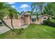One-story house with a two-car garage and manicured lawn at 7127 Otter Creek Dr, New Port Richey, FL 34655