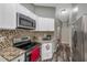 Modern kitchen with granite countertops and stainless steel appliances at 7127 Otter Creek Dr, New Port Richey, FL 34655