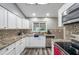 Modern kitchen with granite countertops and stainless steel appliances at 7127 Otter Creek Dr, New Port Richey, FL 34655