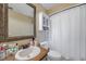Bright bathroom featuring a single vanity and shower/tub at 7127 Otter Creek Dr, New Port Richey, FL 34655