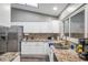 Modern kitchen with granite countertops and stainless steel appliances at 7127 Otter Creek Dr, New Port Richey, FL 34655