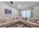 Living area featuring a large sectional sofa and window at 7127 Otter Creek Dr, New Port Richey, FL 34655