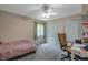 Bedroom with a bed, desk, and closet at 7127 Otter Creek Dr, New Port Richey, FL 34655