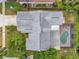 House with pool and fenced backyard, seen from above at 7127 Otter Creek Dr, New Port Richey, FL 34655