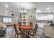 Open concept dining room with wood table and kitchen view at 7127 Otter Creek Dr, New Port Richey, FL 34655