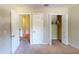Bedroom with double doors to closet and carpet at 905 John Hunter Ct, Brandon, FL 33511