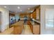 Spacious kitchen with granite countertops, stainless steel appliances, and wood cabinets at 905 John Hunter Ct, Brandon, FL 33511