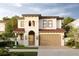 Two-story house with stucco exterior, tile roof, and two-car garage at 320 W Park Ave, Tampa, FL 33602