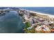 Aerial view showing condo's location near the water, beach, and other buildings at 10301 Gulf Blvd # 201, Treasure Island, FL 33706