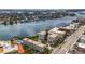Aerial view of condo complex near waterway, highlighting its location and pool at 10301 Gulf Blvd # 201, Treasure Island, FL 33706