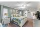 Main bedroom with king-size bed, light walls, and ceiling fan at 10301 Gulf Blvd # 201, Treasure Island, FL 33706