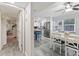 Open concept kitchen with stainless steel appliances and a blue kitchen island at 10301 Gulf Blvd # 201, Treasure Island, FL 33706